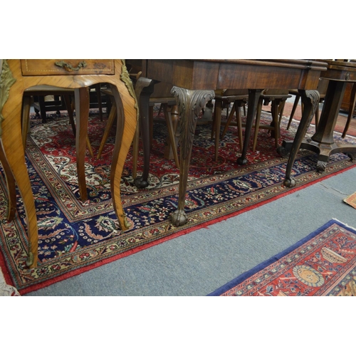 291 - A good large Persian carpet crimson ground with floral decoration 11' 4