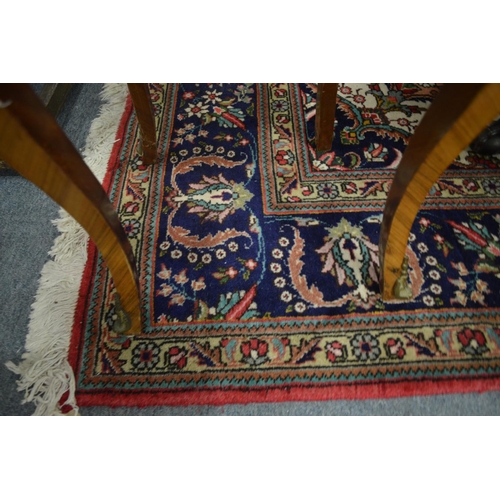 291 - A good large Persian carpet crimson ground with floral decoration 11' 4