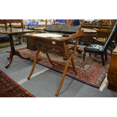 296 - An Edwardian oak folding/travelling desk with fitted leather interior.