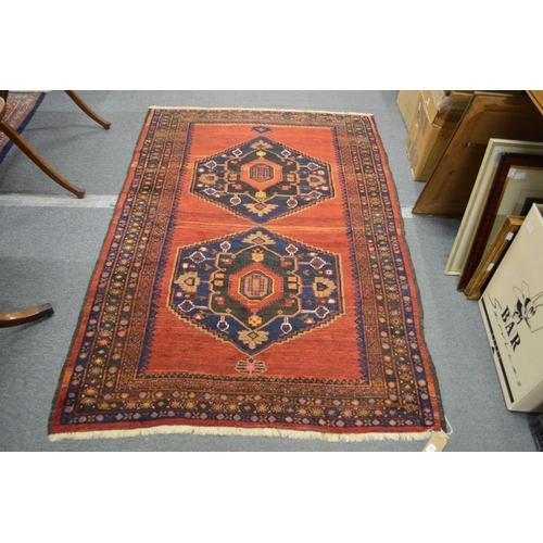 305 - A good small Persian carpet red ground with two large central medallions 7' 2