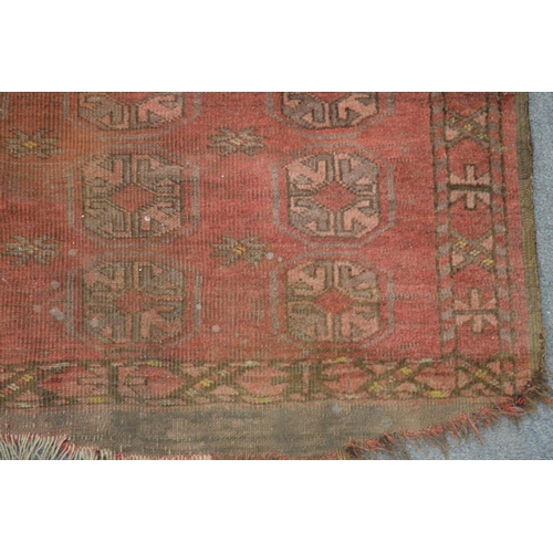 308 - An old Bokhara carpet, worn 7' x 4' 1