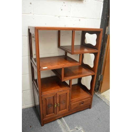 315 - A Chinese hardwood display unit with small cupboard and drawer.