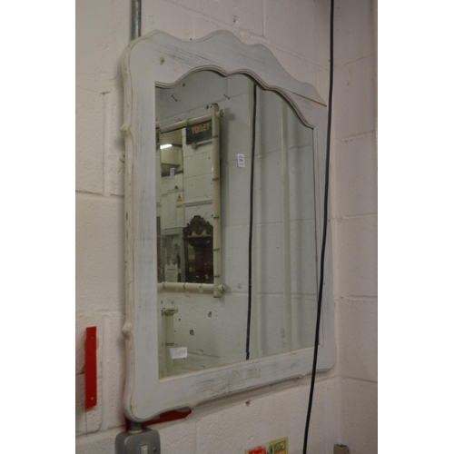 316 - A shaped mirror with painted frame.