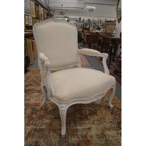 329 - A large French style upholstered open armchair with painted frame.