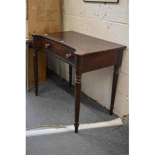 345 - A 19th century mahogany single drawer concave fronted side table on turned supports.