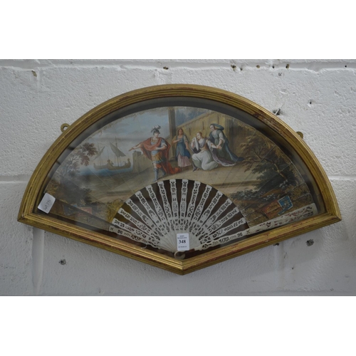 348 - A gilt wood display case containing a decorative painted French fan.