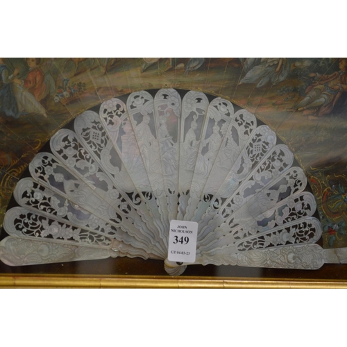 349 - A gilt wood display case containing a decorative painted French fan.