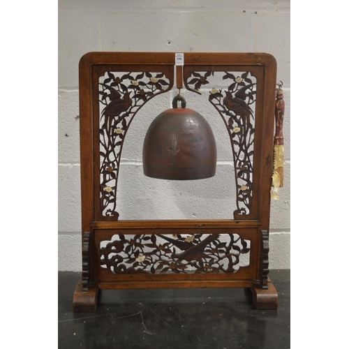 350 - A Chinese 'dinner gong' or temple bell, the hardwood frame with pierced decoration.