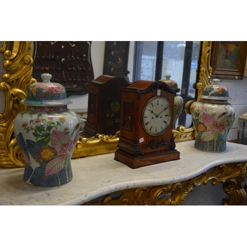 351 - A pair of colourfully decorated Chinese temple jars and covers.