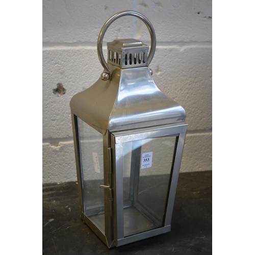 353 - Two metal candle lanterns.