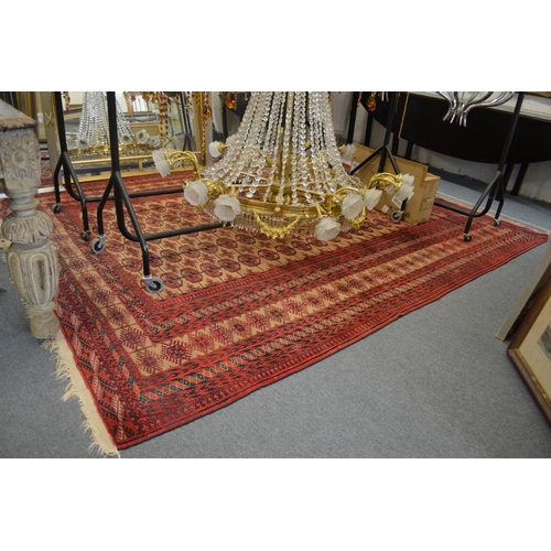 370 - A good large Persian Bokhara carpet, beige ground with five rows of twenty two gulls 9' 10