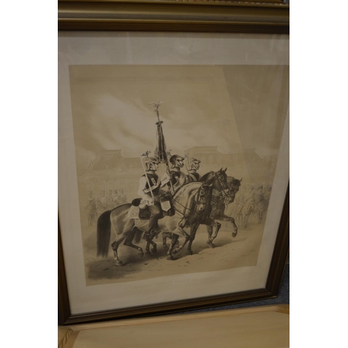 372 - A set of four black and white prints depicting military figures on horseback.