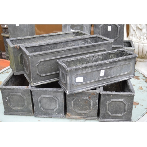 4 - Seven faux lead rectangular planters.