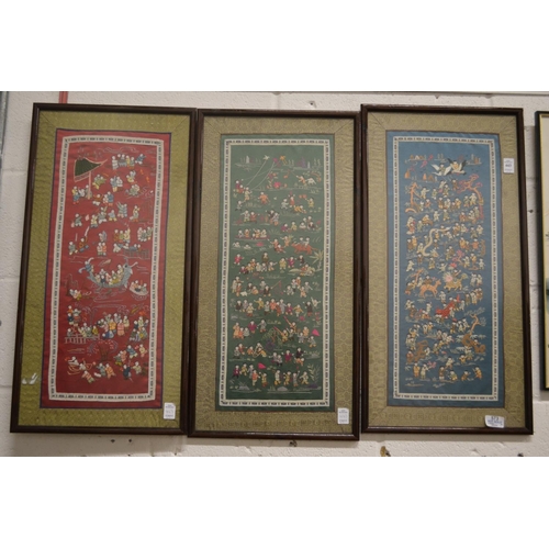 443 - A set of three Chinese embroidered pictures depicting numerous figures.