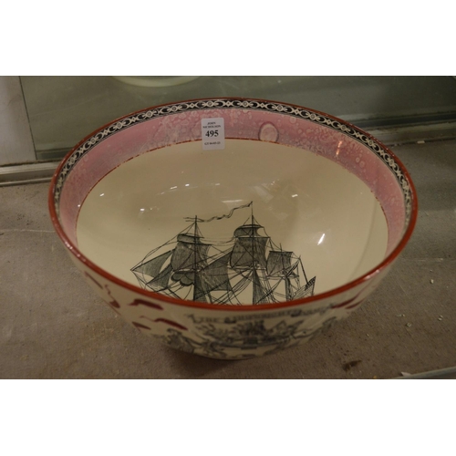 495 - A large lustre ware bowl decorated with the ship Caroline and the Ship Wrights Arms.