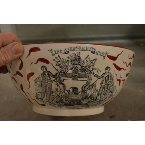 495 - A large lustre ware bowl decorated with the ship Caroline and the Ship Wrights Arms.