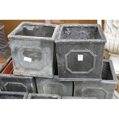 5 - Four square shaped faux lead planters.