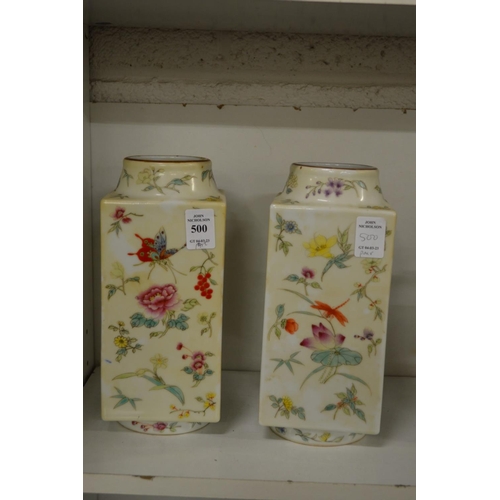 500 - A pair of Chinese famille rose porcelain square shaped vases.