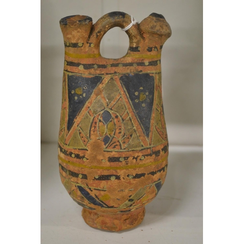 501 - A small decorated terracotta urn.