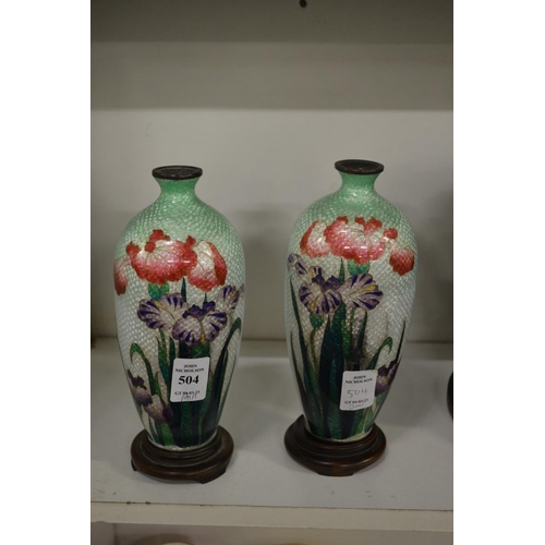 504 - A pair of cloisonne vases on stands (some damage).