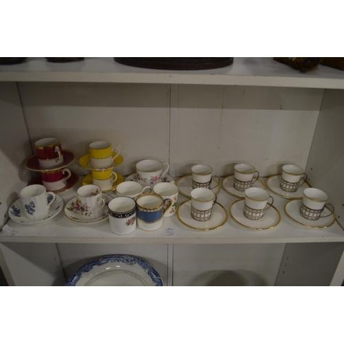 506A - A set of six Shelly coffee cups and saucers with silver holders together with other coffee cups and ... 