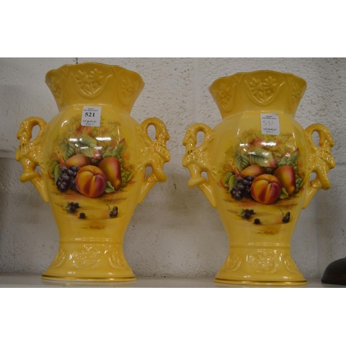 521 - A pair of Aynsley limited edition fruit decorated twin handled vases.