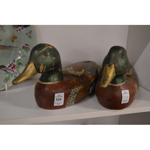 524 - A pair of carved wood and painted models of ducks.