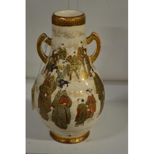 526 - A satsuma twin handled bottle vase, base drilled.