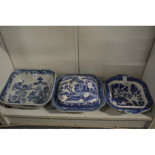 531 - A willow pattern vegetable dish and cover and two other similar dishes.