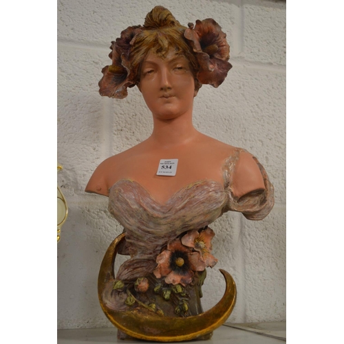 534 - An Art Nouveau pottery bust of a young girl.