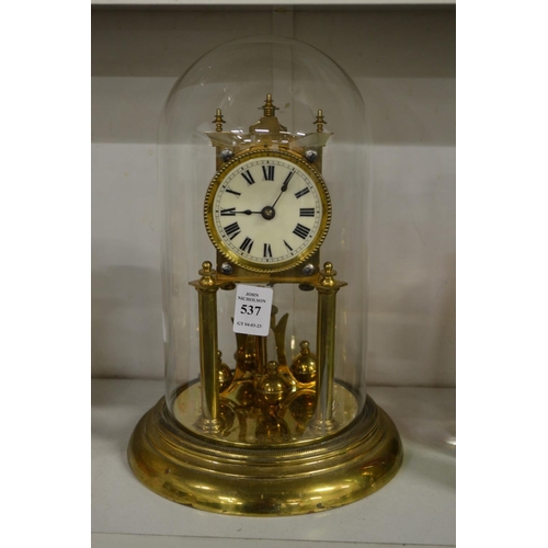 537 - A brass anniversary clock with glass dome.