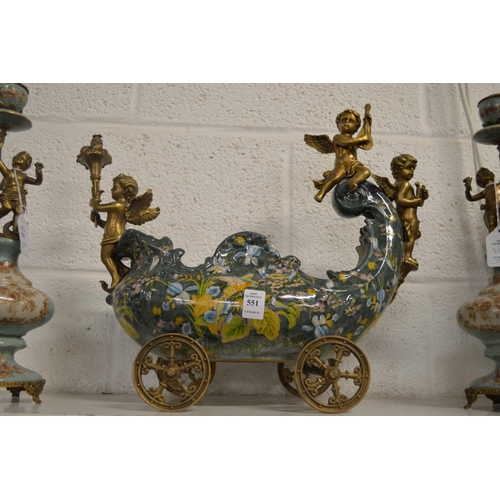 551 - A decorative centrepiece modelled as a carriage with cherubs.