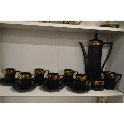 552 - A Portmeirion coffee service, black ground with greek key decoration.