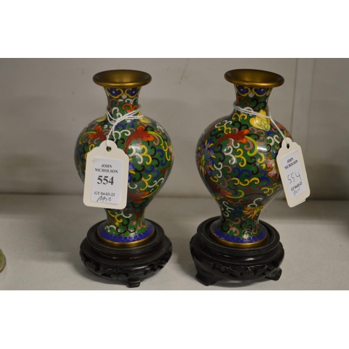 554 - A small pair of cloisonne vases and stands.