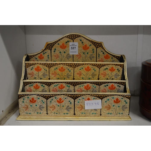 557 - A Persian style lacquer stationery rack.