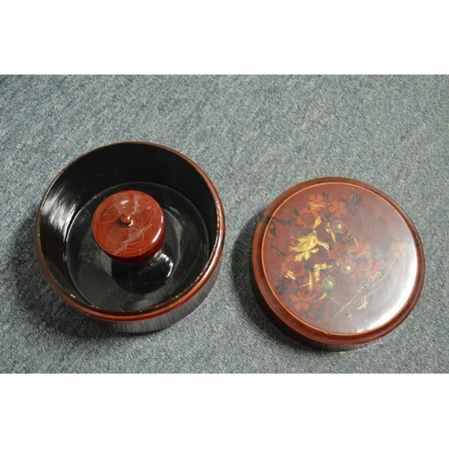 558 - A Chinese circular lacquer bowl and cover.