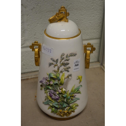 568 - A floral decorated vase and cover.