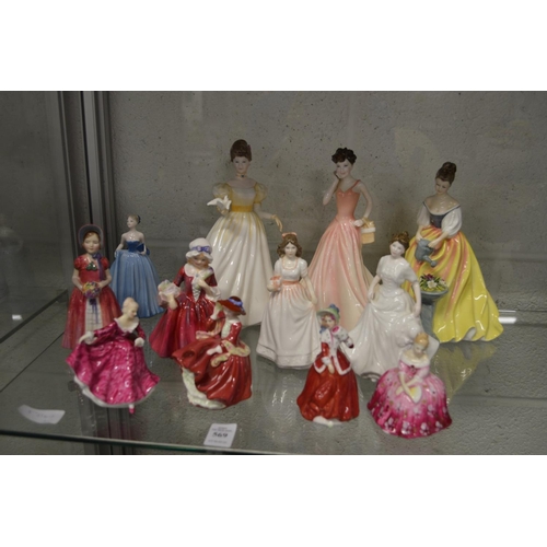 569 - A collection of Doulton and other figurines.