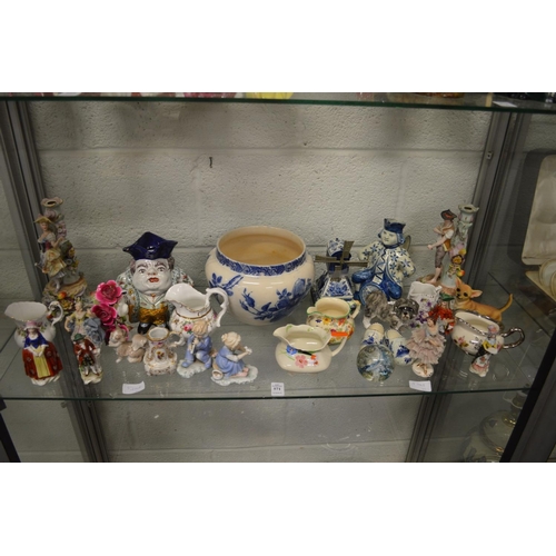 571 - A good collection of decorative china to include figurines, jugs etc.