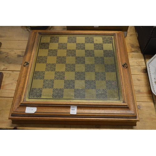 585 - A chess board containing chess pieces.