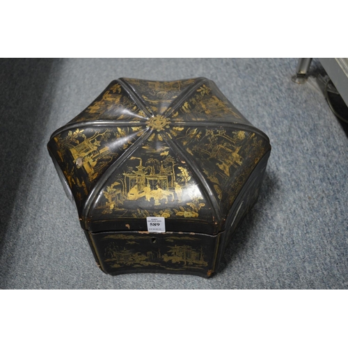 589 - A chinoiserie decorated black lacquer hexagonal shaped box and cover.