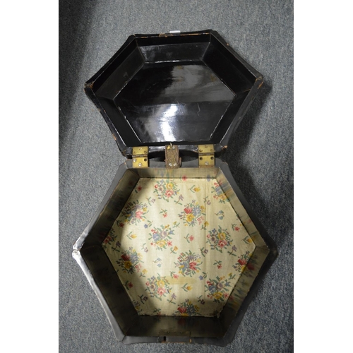 589 - A chinoiserie decorated black lacquer hexagonal shaped box and cover.