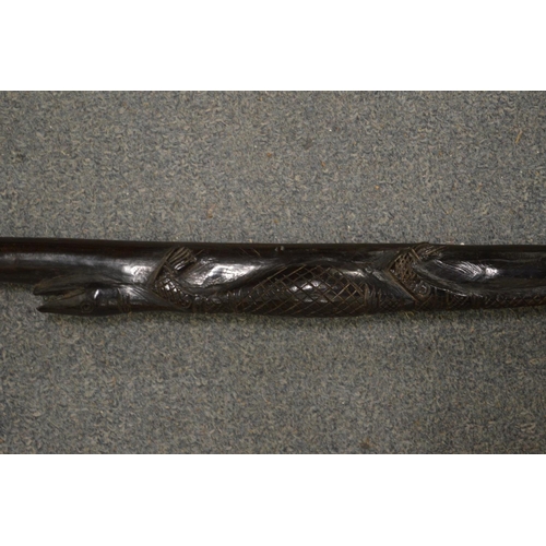 637 - A carved wood walking stick.