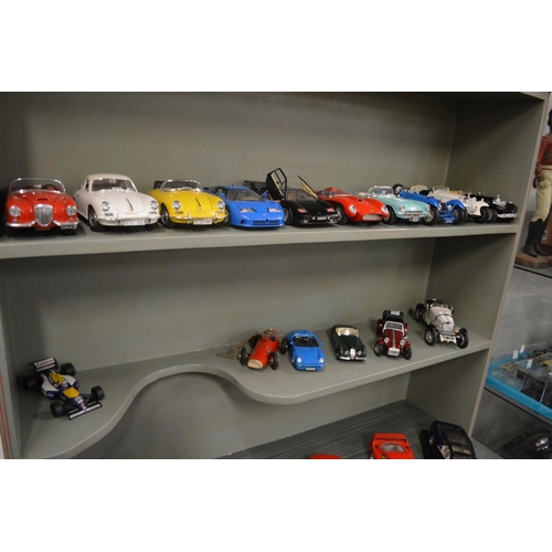 674 - A good collection of Burago model cars together with a Schuco clockwork ferrari.