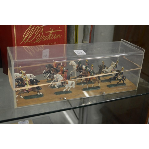 680 - A Die cast set of twelve mounted cavalry, in a perspex case.