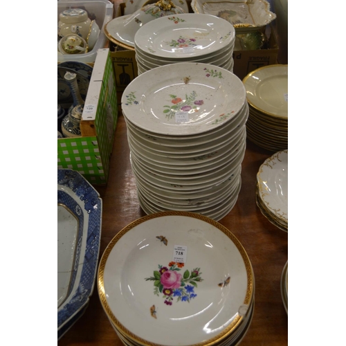 718 - A collection of floral decorated plates.