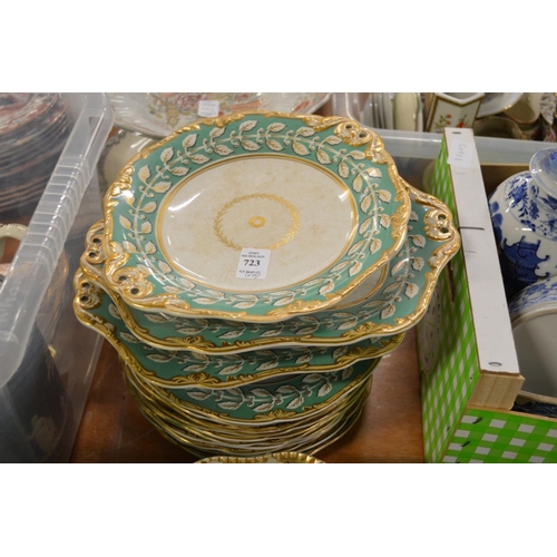 723 - A green and gilt decorated dessert service.