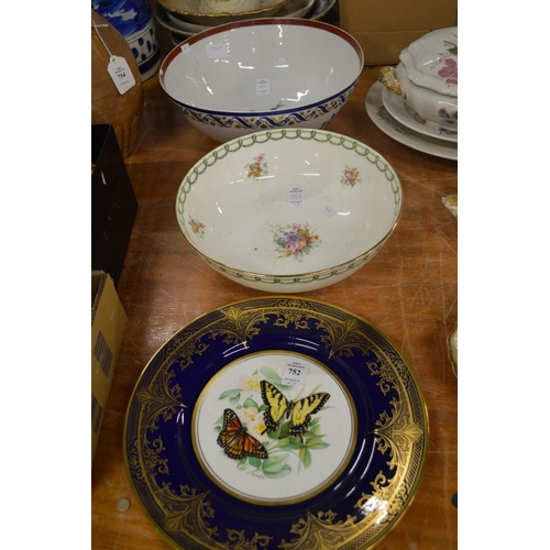 752 - A cabinet plate decorated with butterflies, a Doulton floral decorated bowl and a Samson bowl.