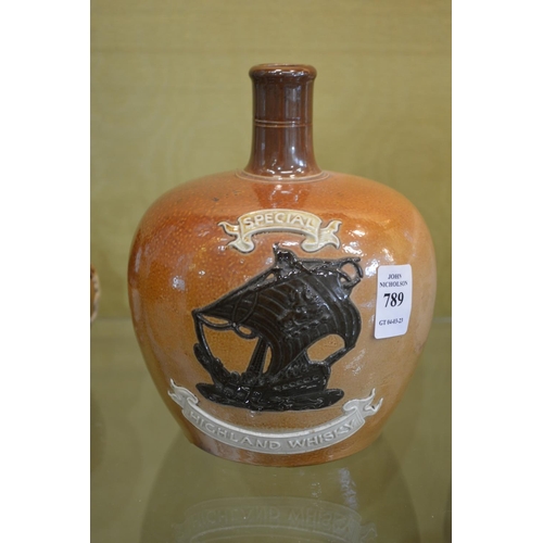 789 - A Doulton salt glazed jug with moulded decoration 'Special Highland Whisky'.