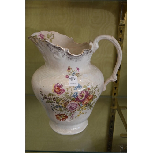 795 - A floral decorated jug.